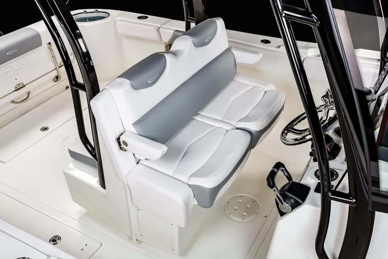 Slide: The Image of Manufacturer Provided Image: 2025 Robalo R302 Center Console boat interior with white and gray seating. - 14