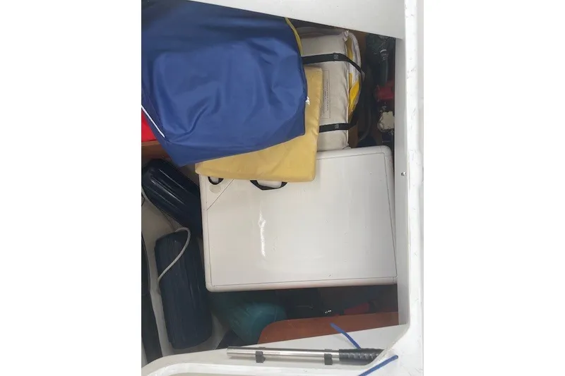 Slide: The Image of Storage compartment of 2017 Jeanneau Sun Odyssey 389 sailboat with bags and equipment. - 18