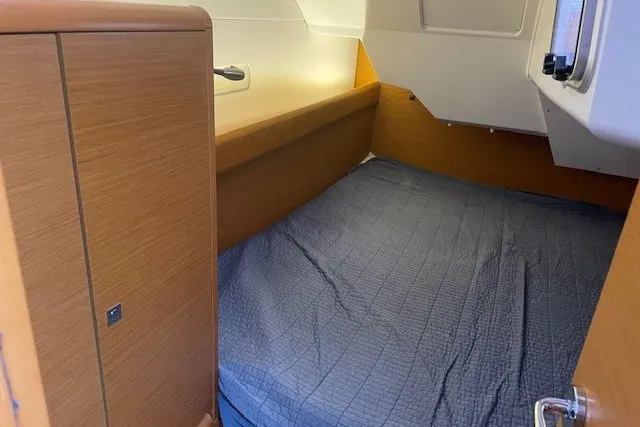 Slide: The Image of Cozy cabin interior of 2017 Jeanneau Sun Odyssey 389 sailboat with wooden finish. - 13