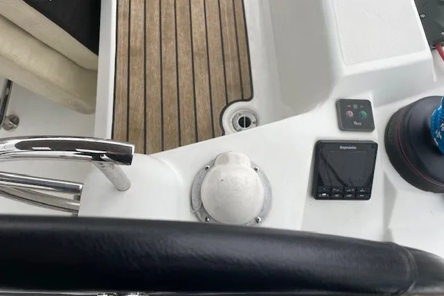 Slide: The Image of Steering area of 2017 Jeanneau Sun Odyssey 389 sailboat with wooden deck and navigation controls. - 15