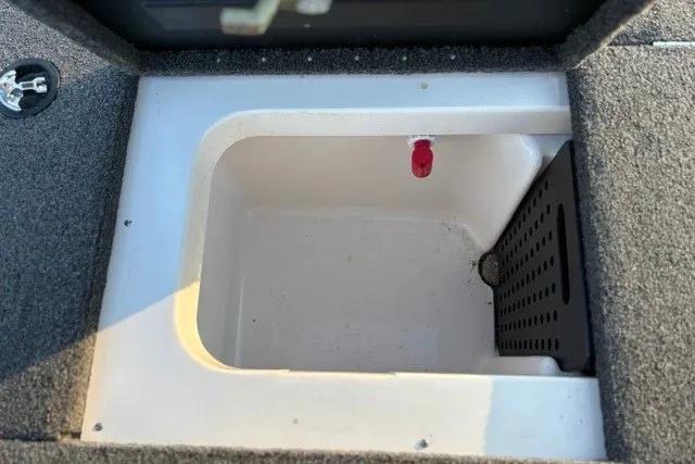 Slide: The Image of 2022 Vexus AVX2080 boat storage compartment with carpeted edges and drainage feature. - 39