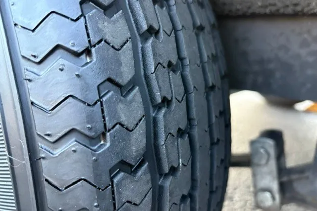 Slide: The Image of Close-up of a 2022 Vexus AVX2080 tire tread pattern. - 64