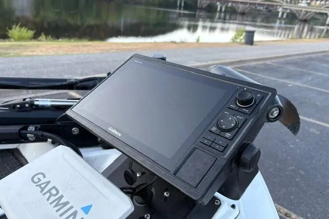 Slide: The Image of Garmin navigation system on 2022 Vexus AVX2080 boat, near a scenic waterfront. - 52