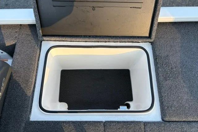 Slide: The Image of Open storage compartment on 2022 Vexus AVX2080 boat, featuring carpeted interior. - 45