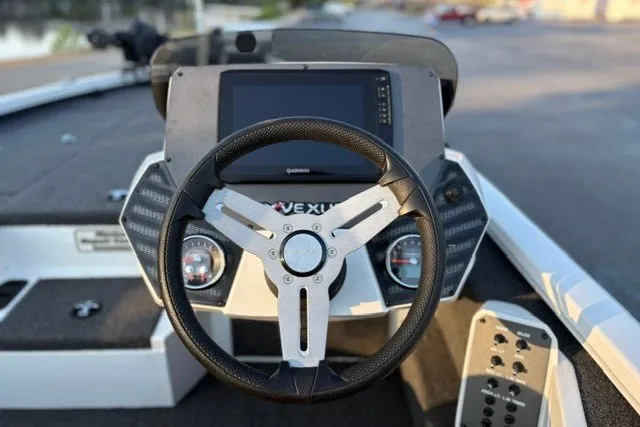Slide: The Image of 2022 Vexus AVX2080 boat dashboard with steering wheel and Garmin display. - 29