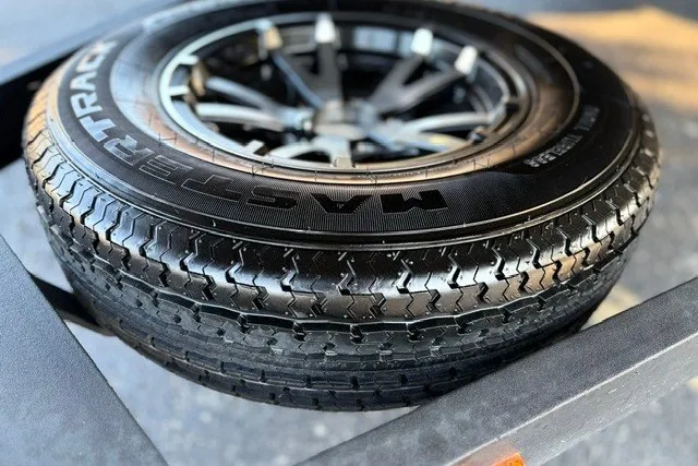 Slide: The Image of Close-up of a 2022 Vexus AVX2080 trailer tire with Mastercraft branding. - 63