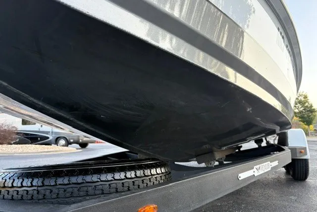 Slide: The Image of 2022 Vexus AVX2080 boat on trailer, close-up view of hull and tire. - 33