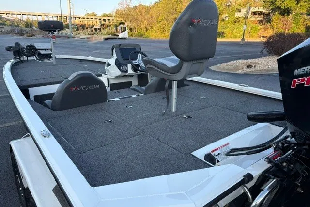 Slide: The Image of 2022 Vexus AVX2080 boat with spacious deck and seating in a parking area. - 20