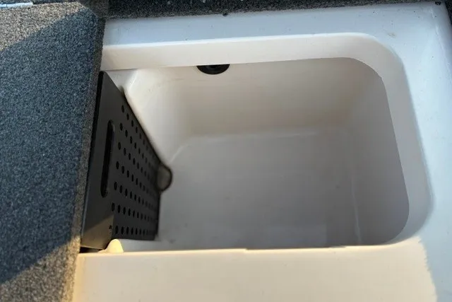 Slide: The Image of Livewell compartment of a 2022 Vexus AVX2080 boat, featuring a clean, white interior. - 41