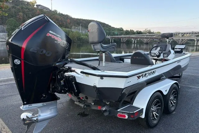 The Image of 2022 Vexus AVX2080 boat with Mercury Pro XS engine, parked near a scenic river. - 7