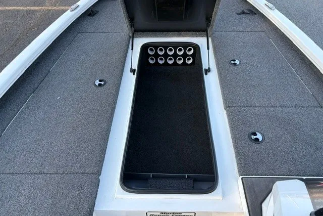 Slide: The Image of 2022 Vexus AVX2080 boat interior with rod storage compartment and carpeted deck. - 60