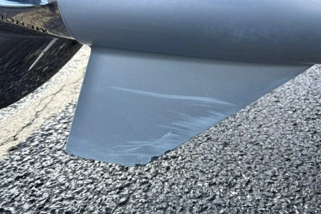 Slide: The Image of Close-up of a scratched propeller blade on a 2022 Vexus AVX2080 boat. - 62