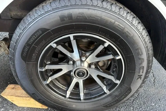 Slide: The Image of 2022 Vexus AVX2080 tire with Master Track branding on a wooden block. - 71