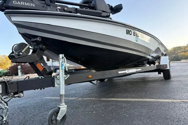 Slide: The Image of 2022 Vexus AVX2080 boat on trailer, featuring Garmin equipment, parked on asphalt. - 23