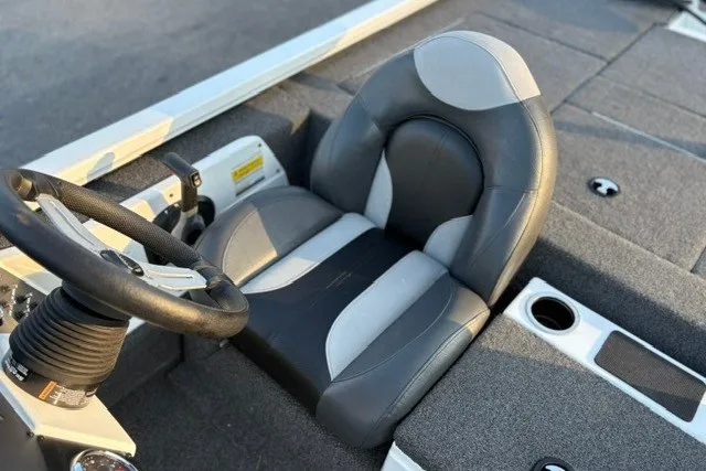Slide: The Image of 2022 Vexus AVX2080 boat interior with gray and black captain's seat and steering wheel. - 38