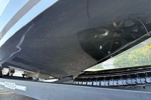 Slide: The Image of 2022 Vexus AVX2080 boat underside on trailer, showcasing hull and wheel detail. - 32