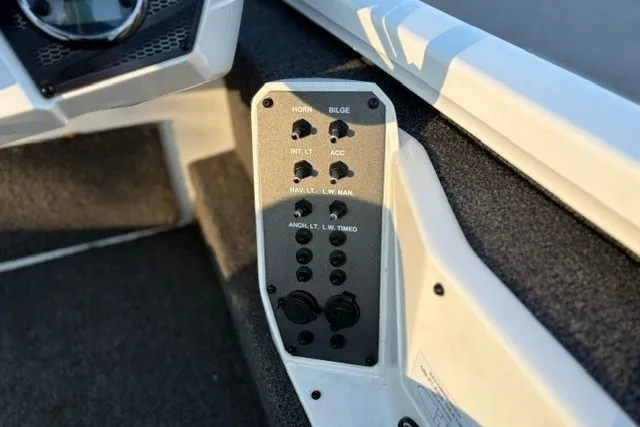 Slide: The Image of Control panel of a 2022 Vexus AVX2080 boat with labeled switches and buttons. - 46