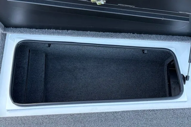 Slide: The Image of Open storage compartment in 2022 Vexus AVX2080 boat, featuring carpeted interior. - 53