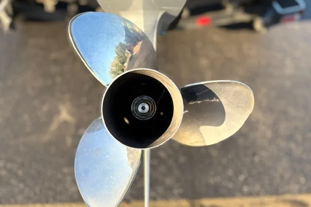 Slide: The Image of Close-up of a 2022 Vexus AVX2080 boat propeller, showcasing its metallic blades. - 17