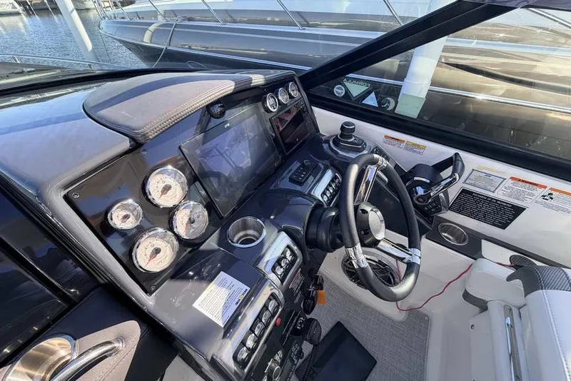 Slide: The Image of 2023 Formula 350 Crossover Bowrider I/O dashboard with modern controls and gauges. - 21