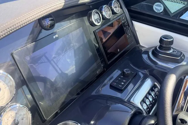 Slide: The Image of Dashboard of 2023 Formula 350 Crossover Bowrider I/O with modern controls and displays. - 44