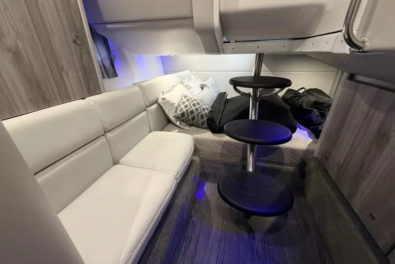Slide: The Image of Interior of 2023 Formula 350 Crossover Bowrider I/O, featuring modern seating and ambient lighting. - 59