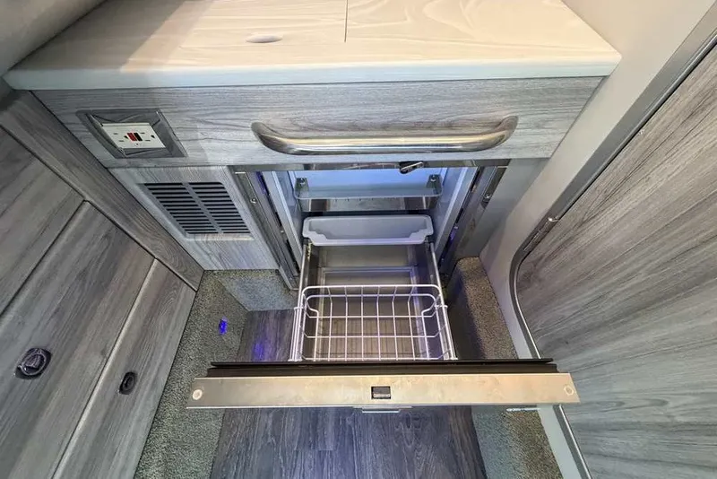 Slide: The Image of 2023 Formula 350 Crossover Bowrider I/O interior with open drawer and modern design. - 67