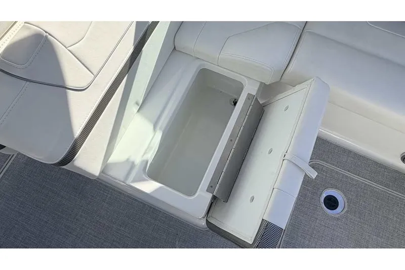 Slide: The Image of 2023 Formula 350 Crossover Bowrider I/O with open storage compartment on deck. - 36