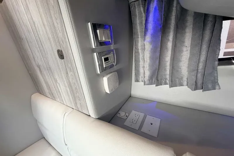 Slide: The Image of Interior of 2023 Formula 350 Crossover Bowrider I/O with modern controls and gray curtains. - 71