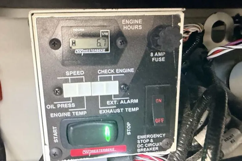 Slide: The Image of Control panel of a 2023 Formula 350 Crossover Bowrider I/O with engine hours display. - 39