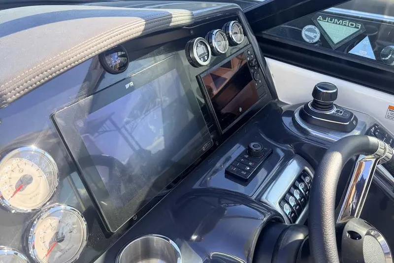 Slide: The Image of Dashboard of 2023 Formula 350 Crossover Bowrider I/O with gauges and controls. - 22