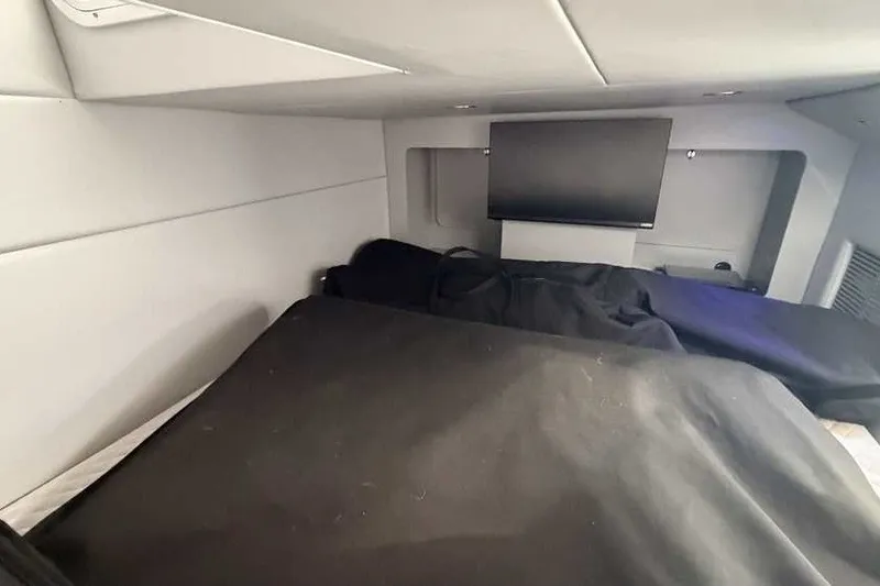 Slide: The Image of 2023 Formula 350 Crossover Bowrider I/O cabin interior with TV and seating area. - 73