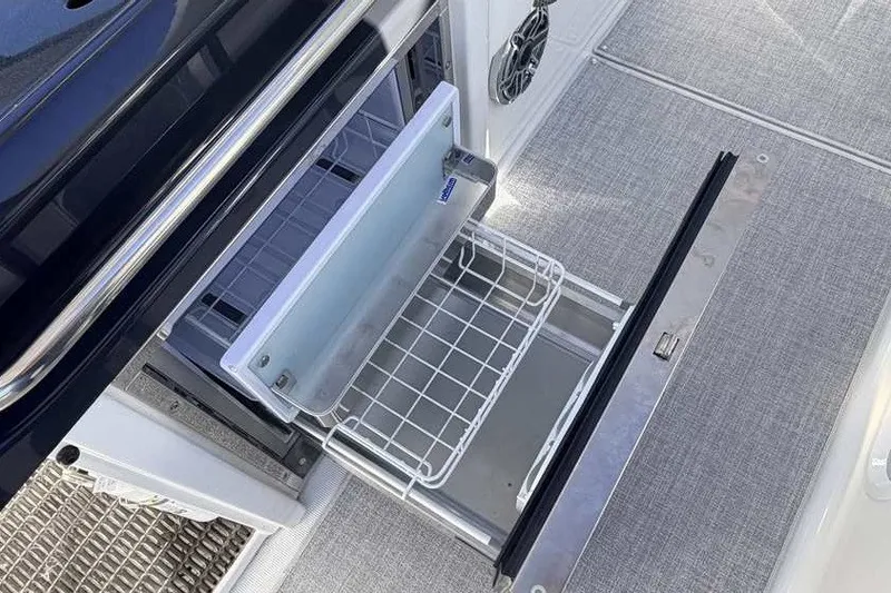 Slide: The Image of Open storage compartment on 2023 Formula 350 Crossover Bowrider I/O boat. - 35