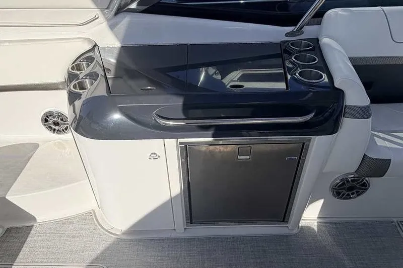 Slide: The Image of Interior of 2023 Formula 350 Crossover Bowrider I/O with sleek kitchenette and cup holders. - 11