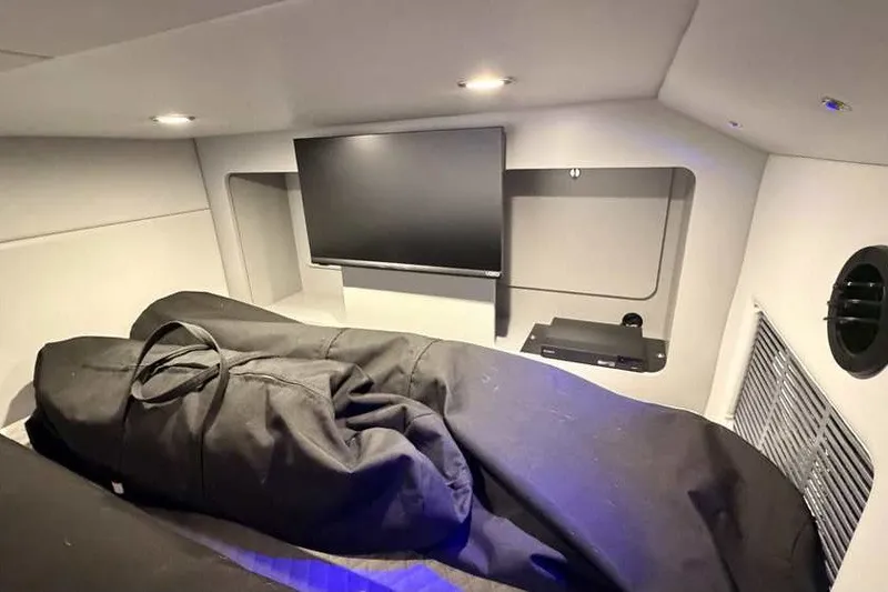 Slide: The Image of Interior cabin of 2023 Formula 350 Crossover Bowrider I/O with TV and storage. - 76