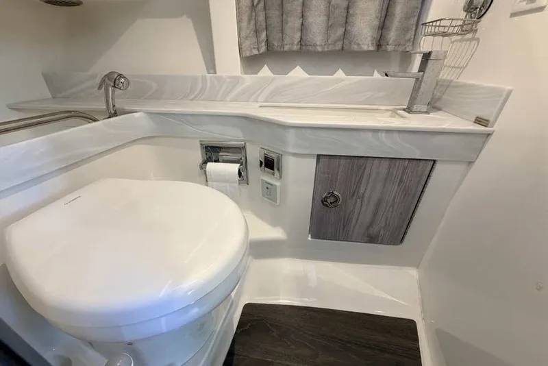 Slide: The Image of 2023 Formula 350 Crossover Bowrider I/O bathroom with modern fixtures and sleek design. - 63