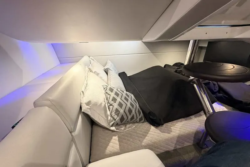 Slide: The Image of Interior cabin of 2023 Formula 350 Crossover Bowrider I/O with cozy bedding and seating. - 57