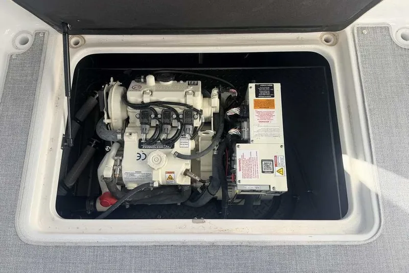 Slide: The Image of Engine compartment of 2023 Formula 350 Crossover Bowrider I/O, showcasing mechanical components. - 16