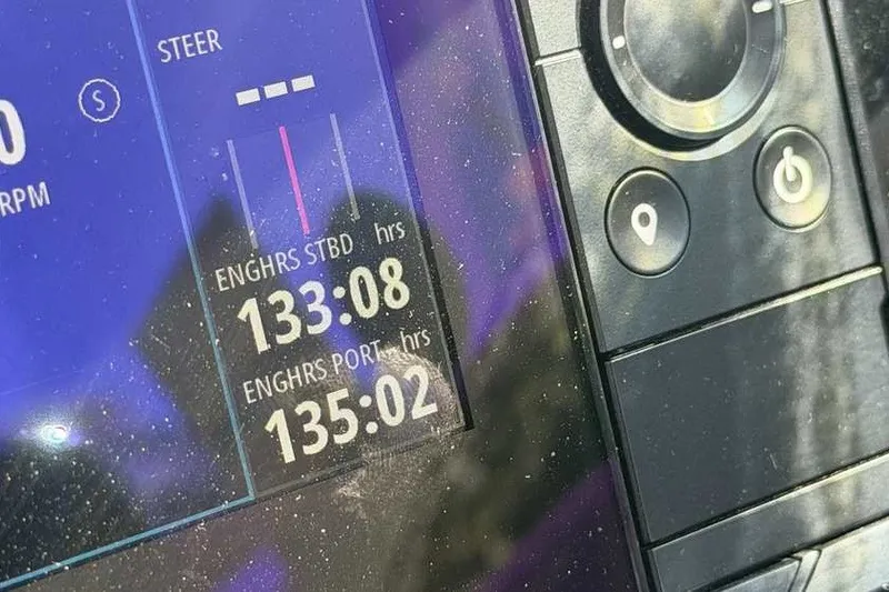 Slide: The Image of Close-up of a 2023 Formula 350 Crossover Bowrider I/O engine hours display. - 33