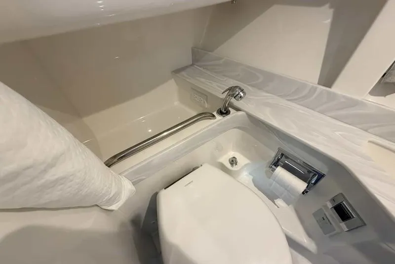 Slide: The Image of 2023 Formula 350 Crossover Bowrider I/O bathroom with modern fixtures and compact design. - 65