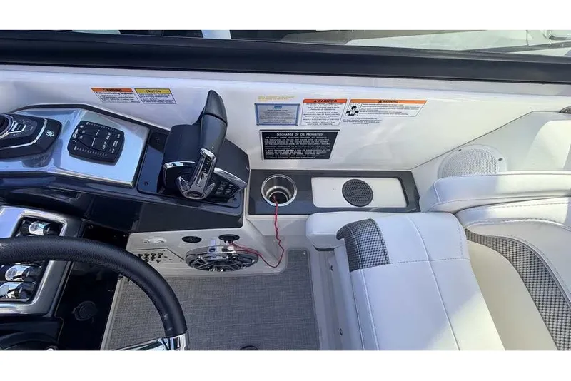 Slide: The Image of 2023 Formula 350 Crossover Bowrider I/O cockpit with controls and seating detail. - 47