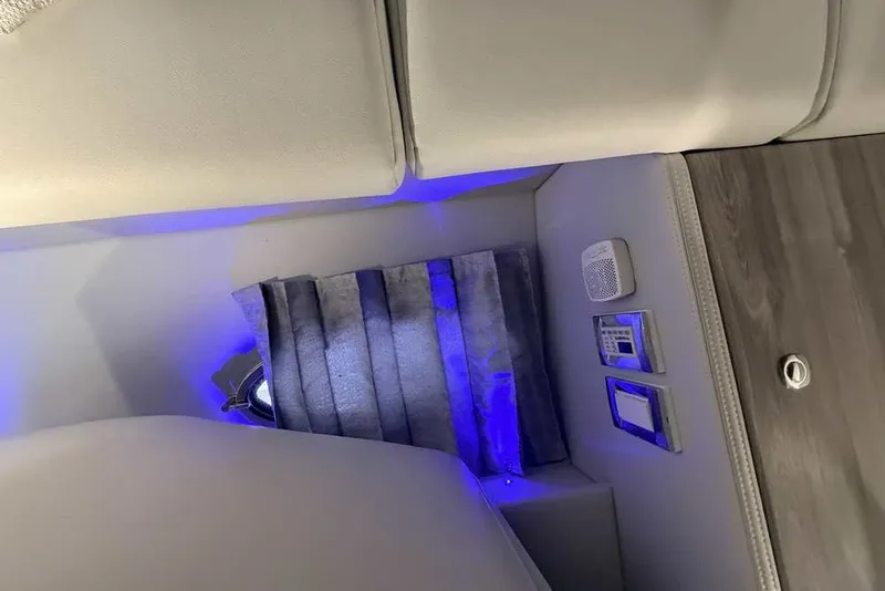 Slide: The Image of 2023 Formula 350 Crossover Bowrider I/O interior with blue LED lighting and control panels. - 60
