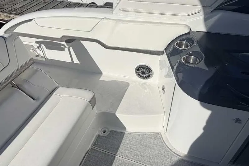 Slide: The Image of Interior of 2023 Formula 350 Crossover Bowrider I/O, featuring seating and cup holders. - 10