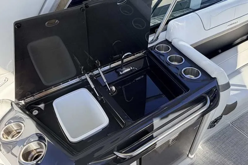 Slide: The Image of 2023 Formula 350 Crossover Bowrider I/O boat interior with sink and cup holders. - 34