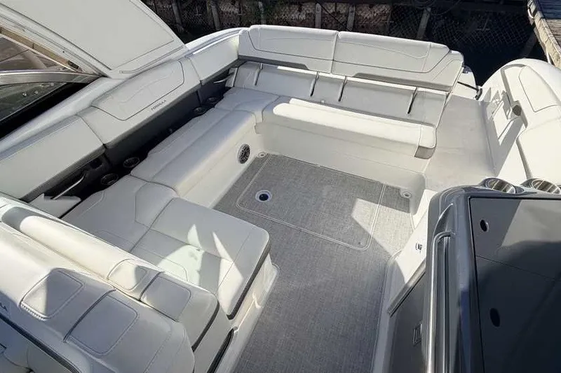Slide: The Image of 2023 Formula 350 Crossover Bowrider I/O interior with spacious seating and modern design. - 9