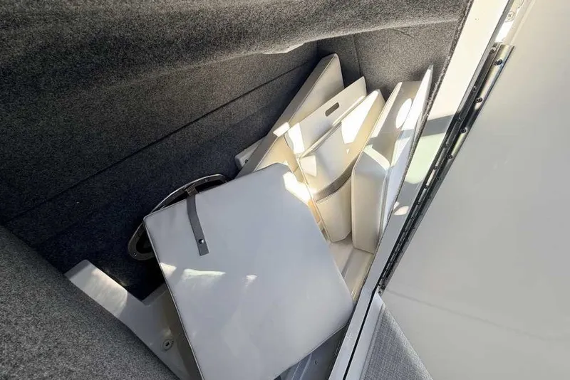 Slide: The Image of Storage compartment of 2023 Formula 350 Crossover Bowrider I/O with cushions and accessories. - 13