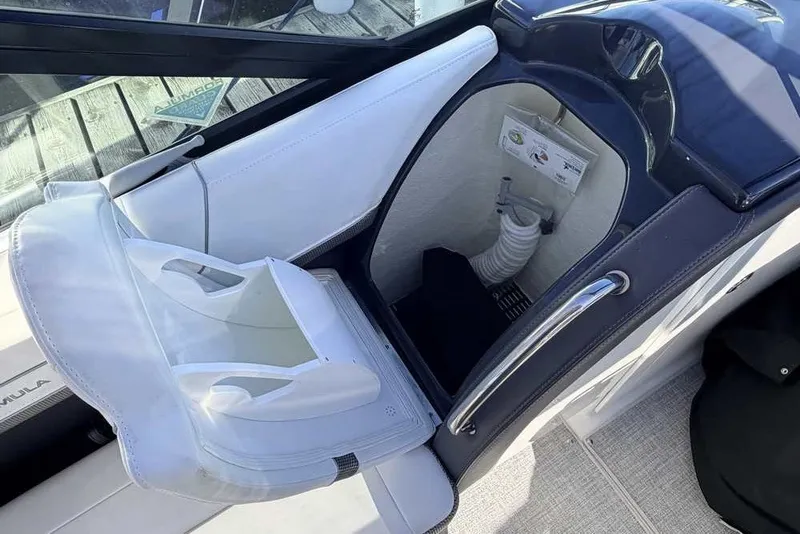 Slide: The Image of 2023 Formula 350 Crossover Bowrider I/O interior with storage compartment and seating. - 30