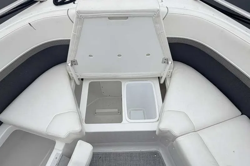 Slide: The Image of 2023 Formula 350 Crossover Bowrider I/O interior with open storage compartment. - 56