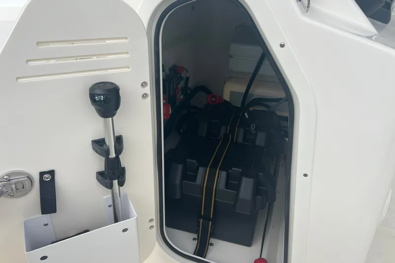 Slide: The Image of 2027 Boston Whaler 150 Montauk storage compartment with equipment and accessories. - 11