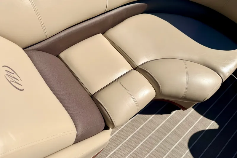 Slide: The Image of Luxurious beige seating on 2021 Manitou 23 Oasis boat, showcasing comfort and style. - 74